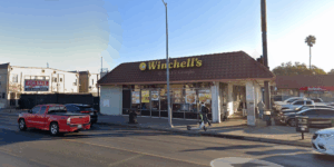 Armed man dressed in a bikini attempts to rob donut shop thwarted as staff fight back