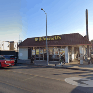Armed man dressed in a bikini attempts to rob donut shop thwarted as staff fight back