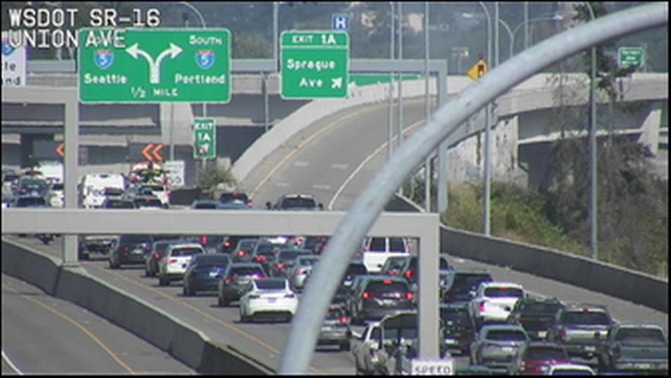 Traffic backs up on State Route 16 due to a brush fire on July 19, 2025. Crews are working on putting out hot spots.