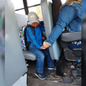 Bus driver holding a boy’s hand doesn’t seem a big deal until police see it and decide to respond