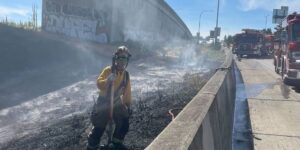 Here are a few options, with the best one at the top:

Tacoma Brush Fire Disrupts State Route 16 Traffic
Brush Fire Slows Traffic on SR 16 in Tacoma
SR 16 Backed Up Due to Tacoma Brush Fire