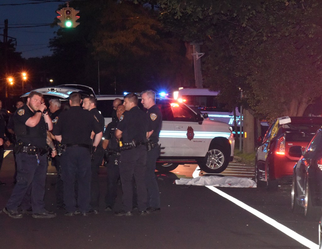Police officers at the scene of a fatal accident.