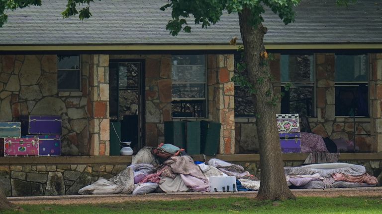 Bedding items are seen outside sleeping quarters at Camp Mystic. Pic: AP/Julio Cortez